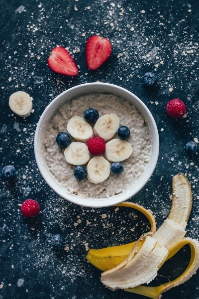 healthy oatmeal with bananas and blueberries on top