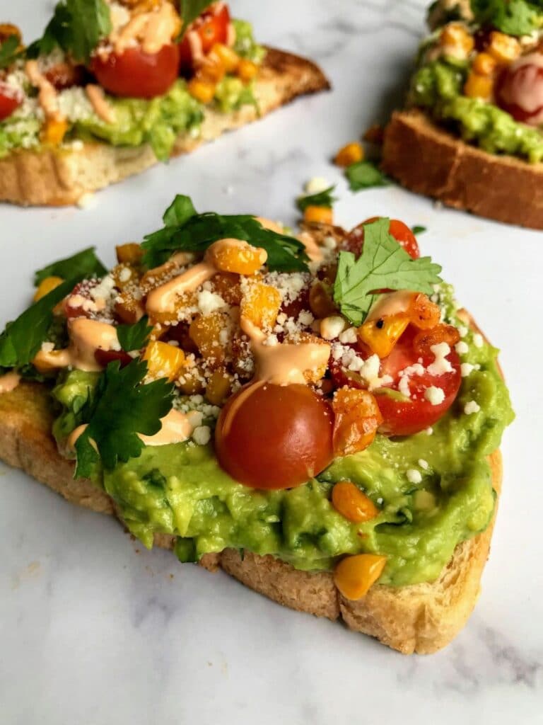 avocado toast with tomatoes and corn.