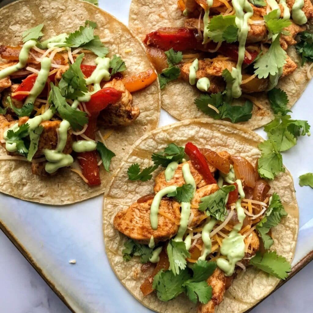 chicken fajita tacos with avocado crema